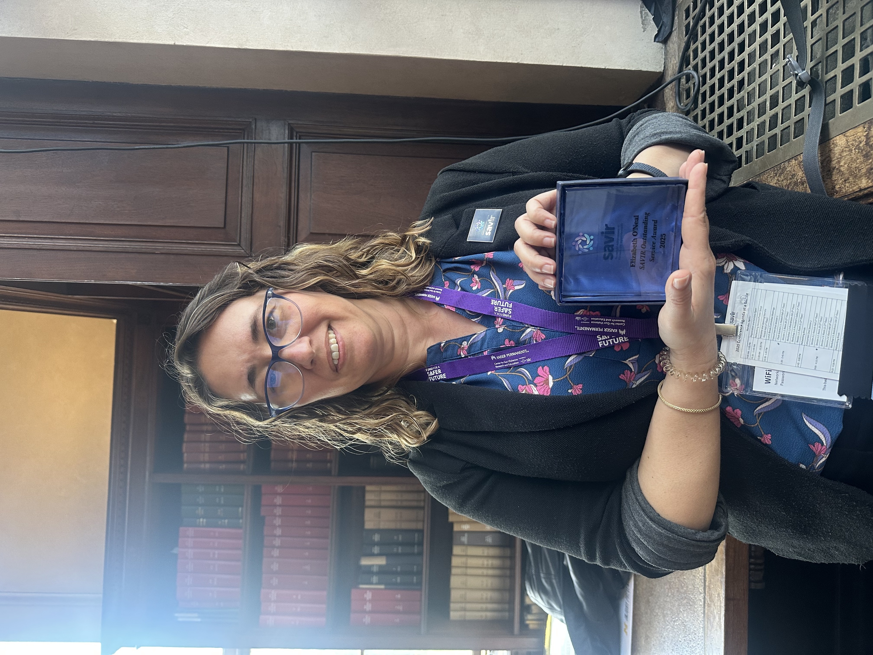 Elizabeth O'Neal with Award